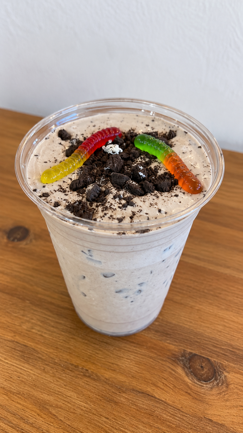 Cookies and cream dessert cup with gummy worms